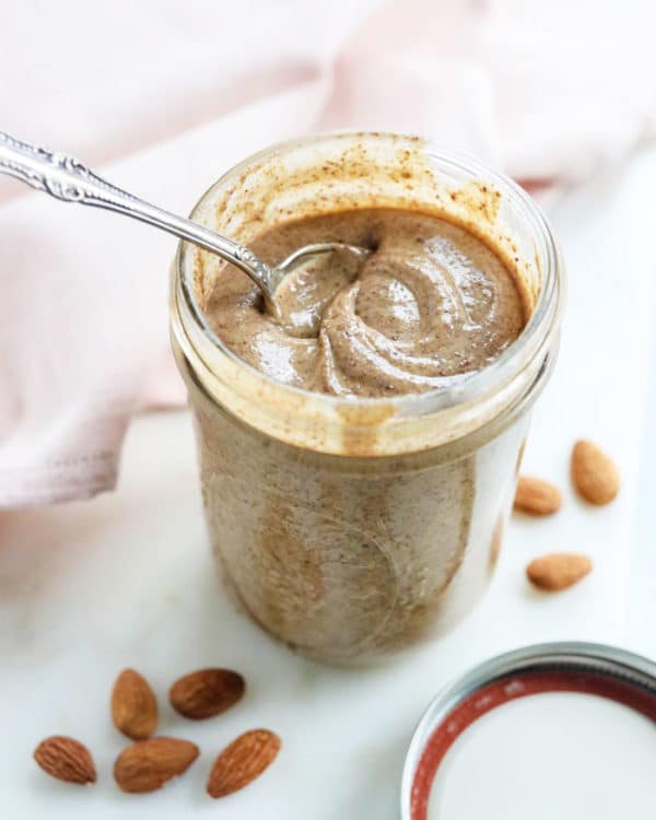 homemade almond butter in a jar with spoon