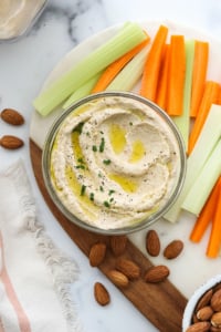 almond pulp hummus served with carrots and celery sticks.