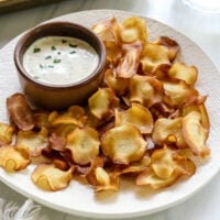 parsnip chips on plate with ranch dip.