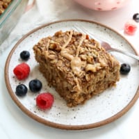 banana baked oatmeal served with berries.