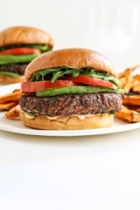 veggie burgers on white plates