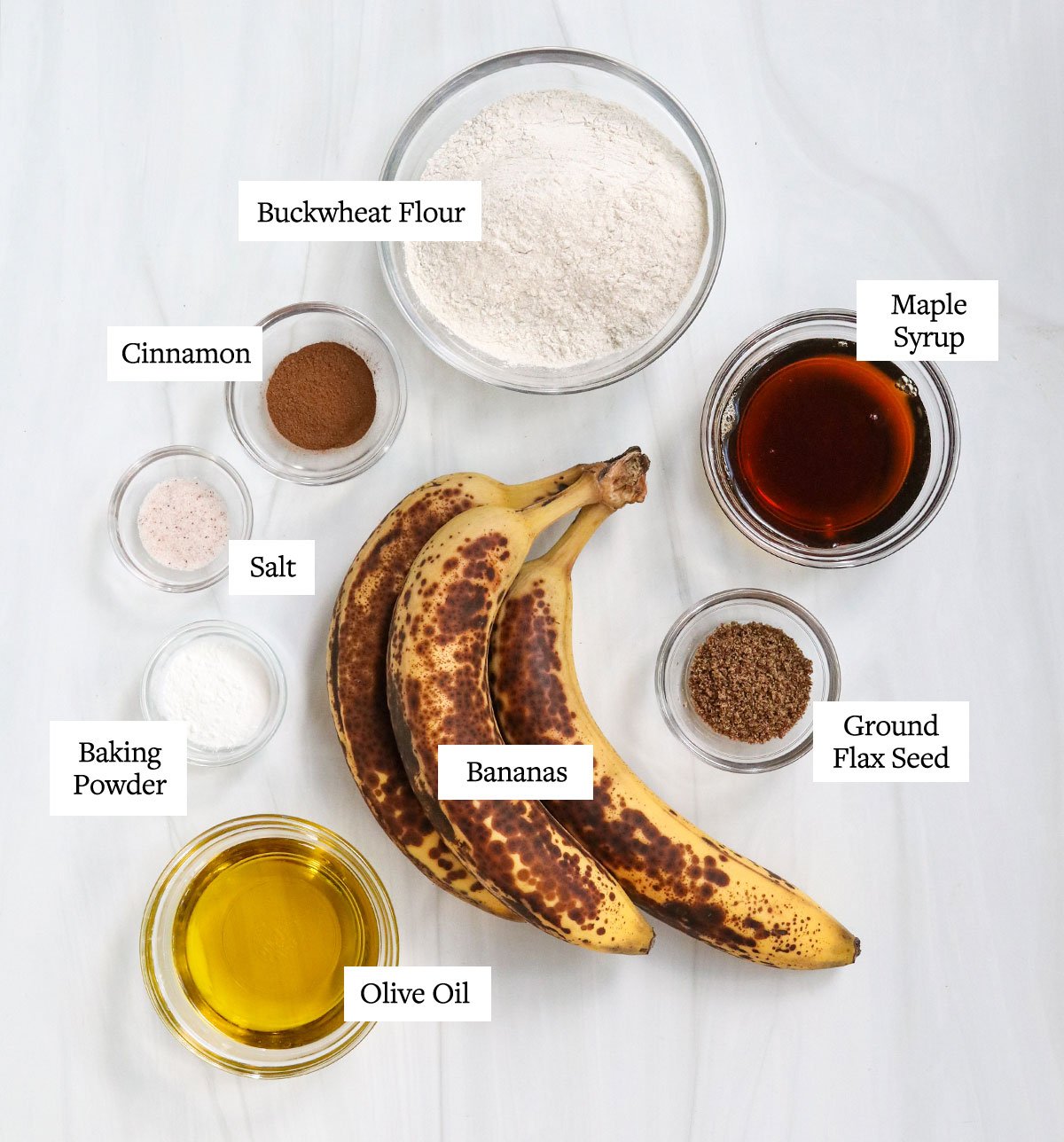 buckwheat muffin ingredients labeled on white surface.