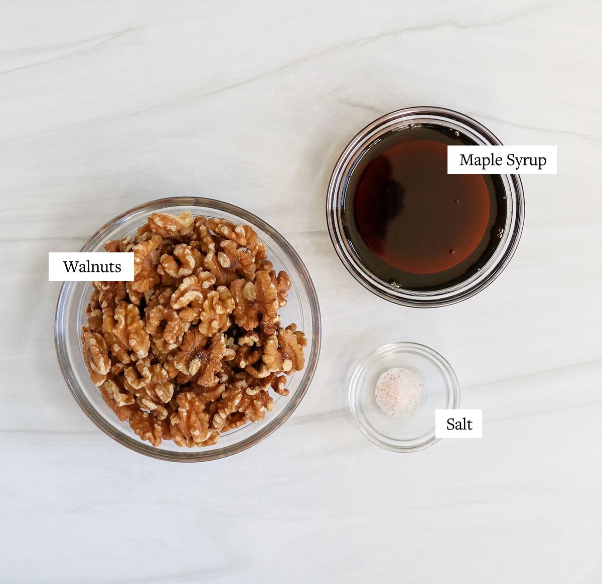 candied walnut ingredients labeled in glass bowls.