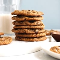 chickpea flour cookies stacked on marble board