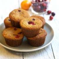 Plate of orange cranberry coconut flour muffins