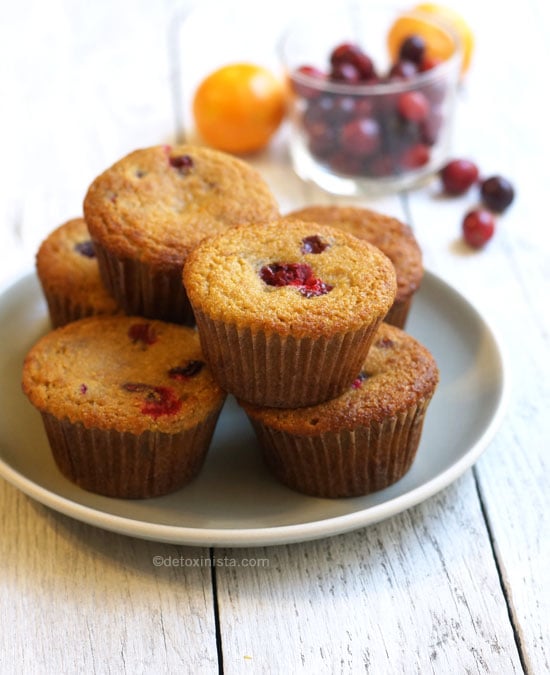 orange cranberry coconut flour muffins on a plate