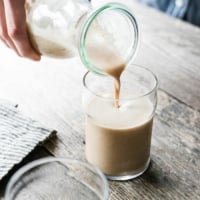 almond milk pouring into glass