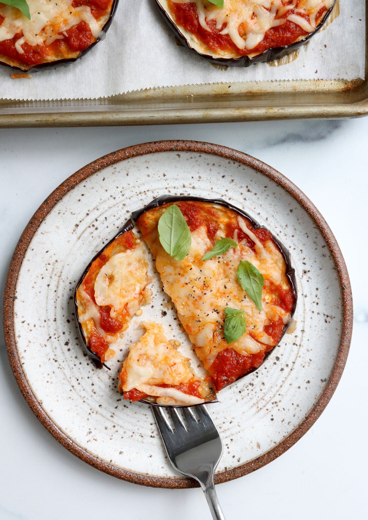 eggplant pizza sliced with fork