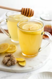 honey added to cup of ginger tea