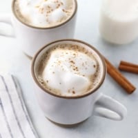 healthy chai latte recipe in two white mugs