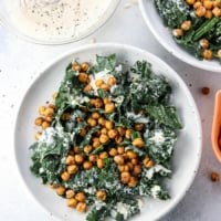 kale Caesar salad in two bowls overhead