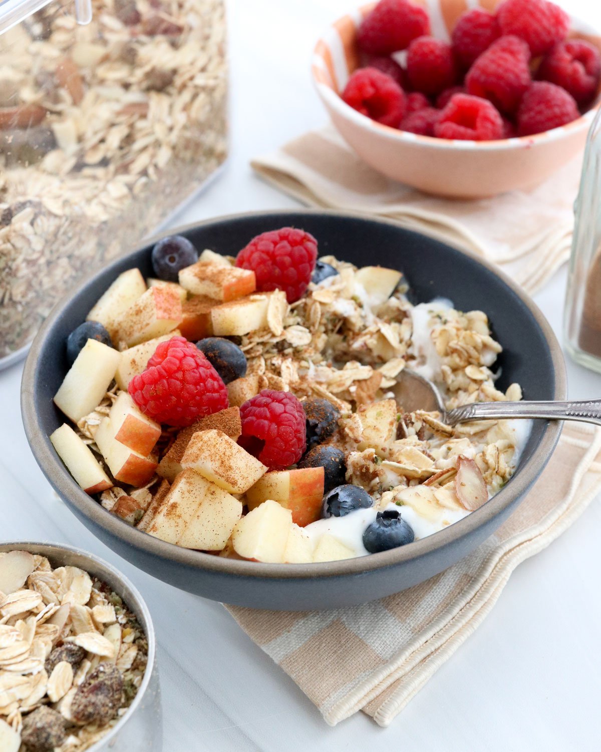 muesli served with yogurt and fruit.