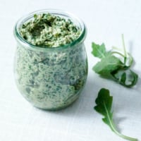 argula pesto in jar with arugula