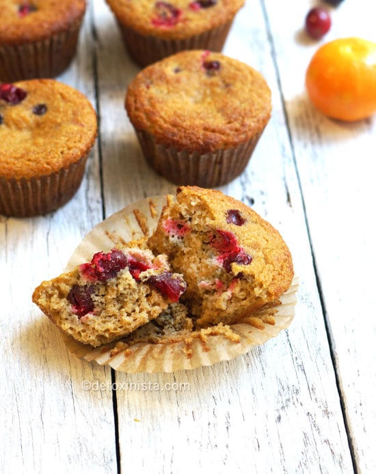 orange cranberry coconut flour muffins with one broken in half