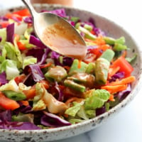 peanut dressing poured over salad