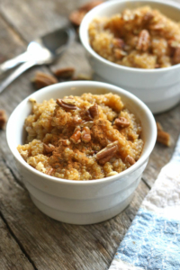 pumpkin porridge in ramekin on wood surface