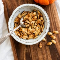 roasted pumpkin seeds in a white bowl