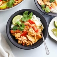 salmon curry in bowl with fresh cilantro on top