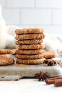 snickerdoodles stacked on pan