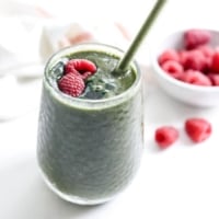 spirulina smoothie with raspberries on top