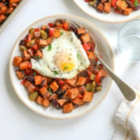 sweet potato hash on plate with egg