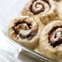 gluten free cinnamon rolls in glass baking dish.