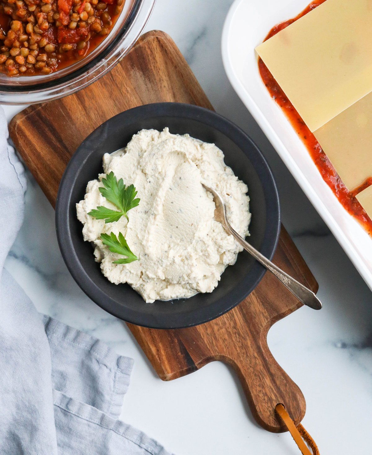 vegan ricotta next to lasagna ingredients