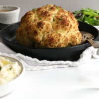 whole roasted cauliflower in pan